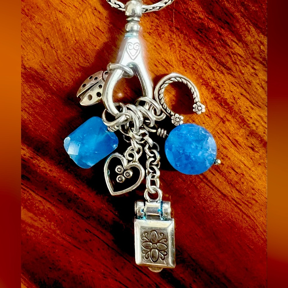 Brighton necklace with multiple charms. In perfect condition!